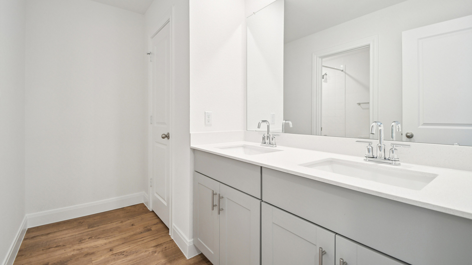 Secondary bathroom with double vanity sink.