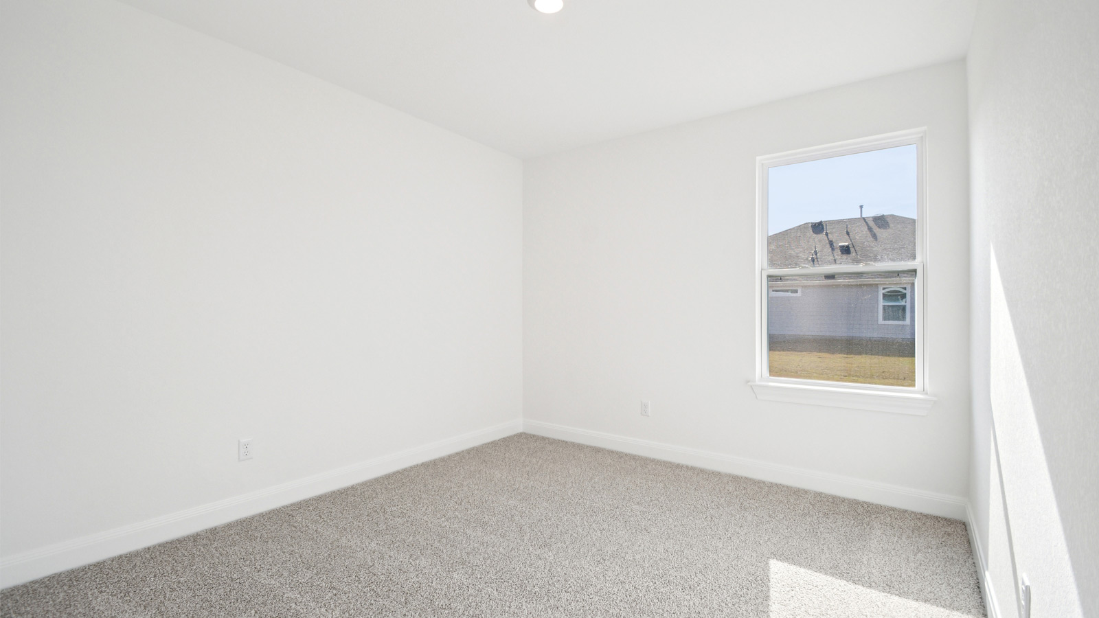 Bedroom 3 with carpeted floor.