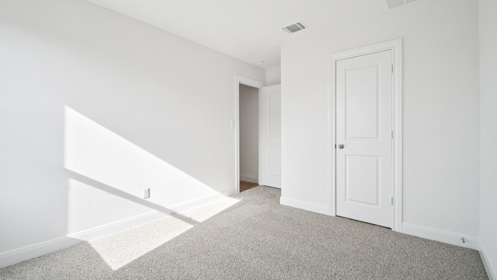Bedroom 3 with carpeted floor.