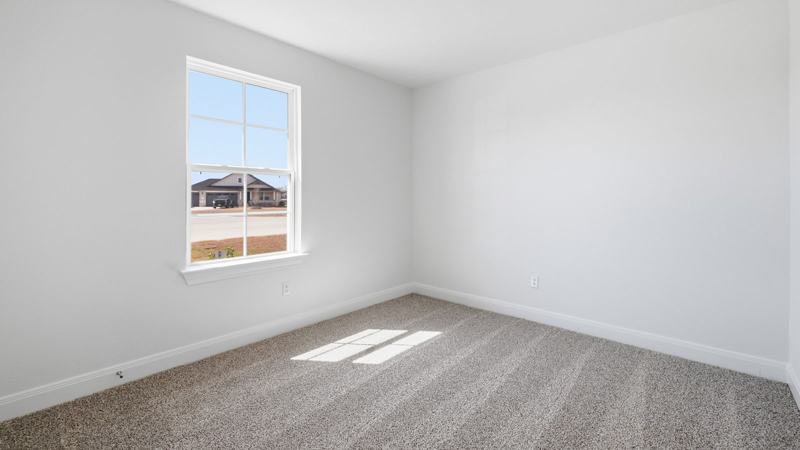 Bedroom 3 with carpeted flooring.