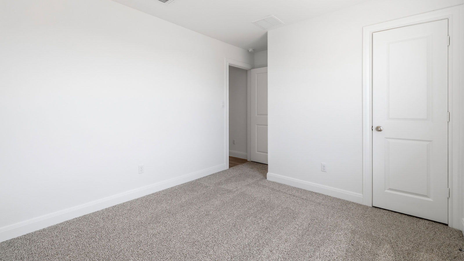 Bedroom 3 with carpeted flooring.