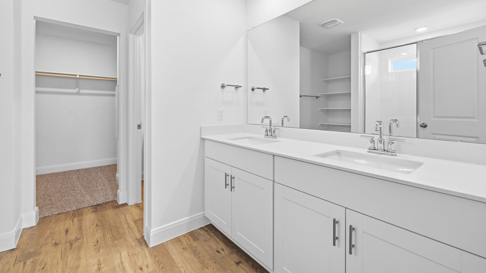 Secondary bathroom with double vanity sink.