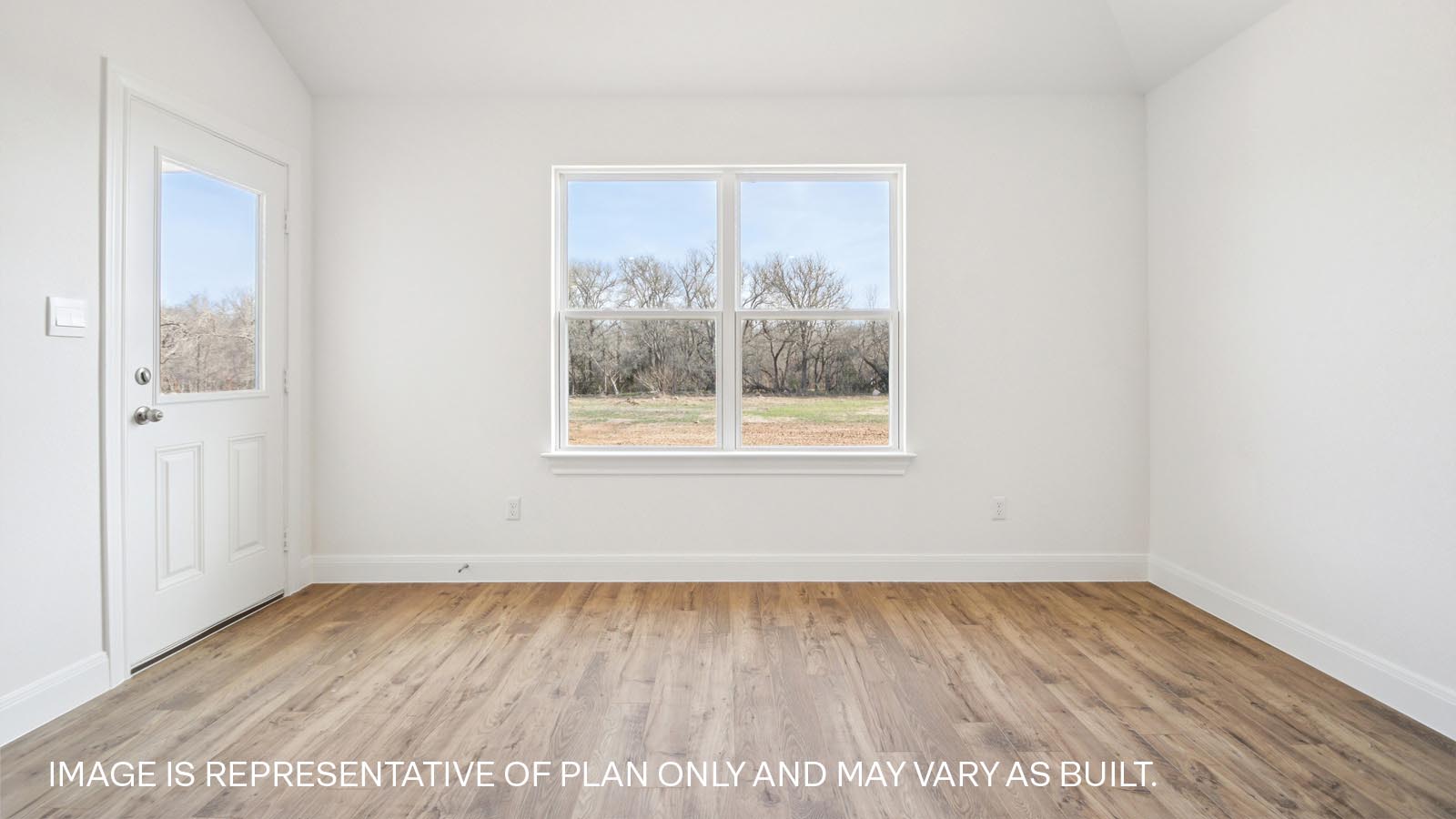 Dining area with two windows and backdoor.