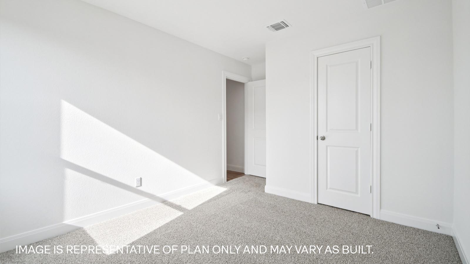 Bedroom 3 with carpeted floor.