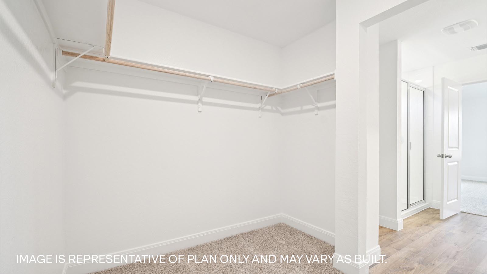 Walk-in closet in primary bathroom.