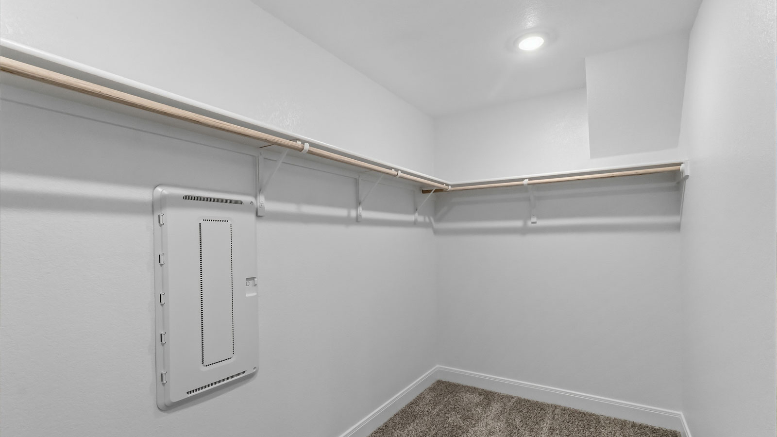 Walk-in closet in primary bathroom.