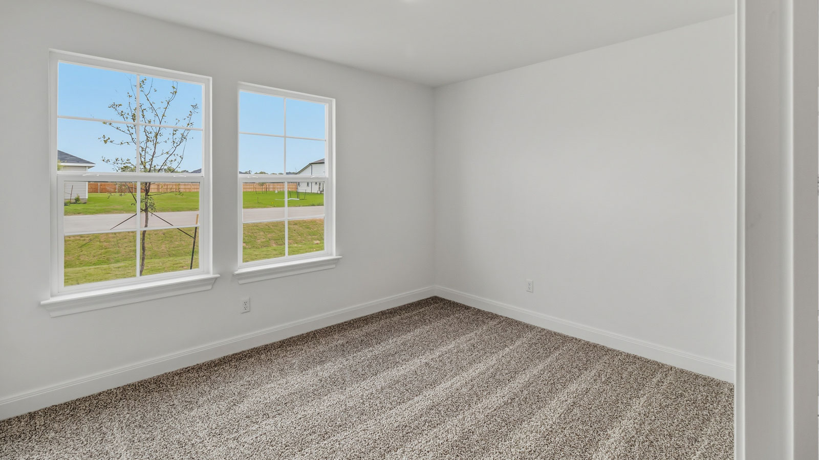 Secondary bedroom located at the front of the home.