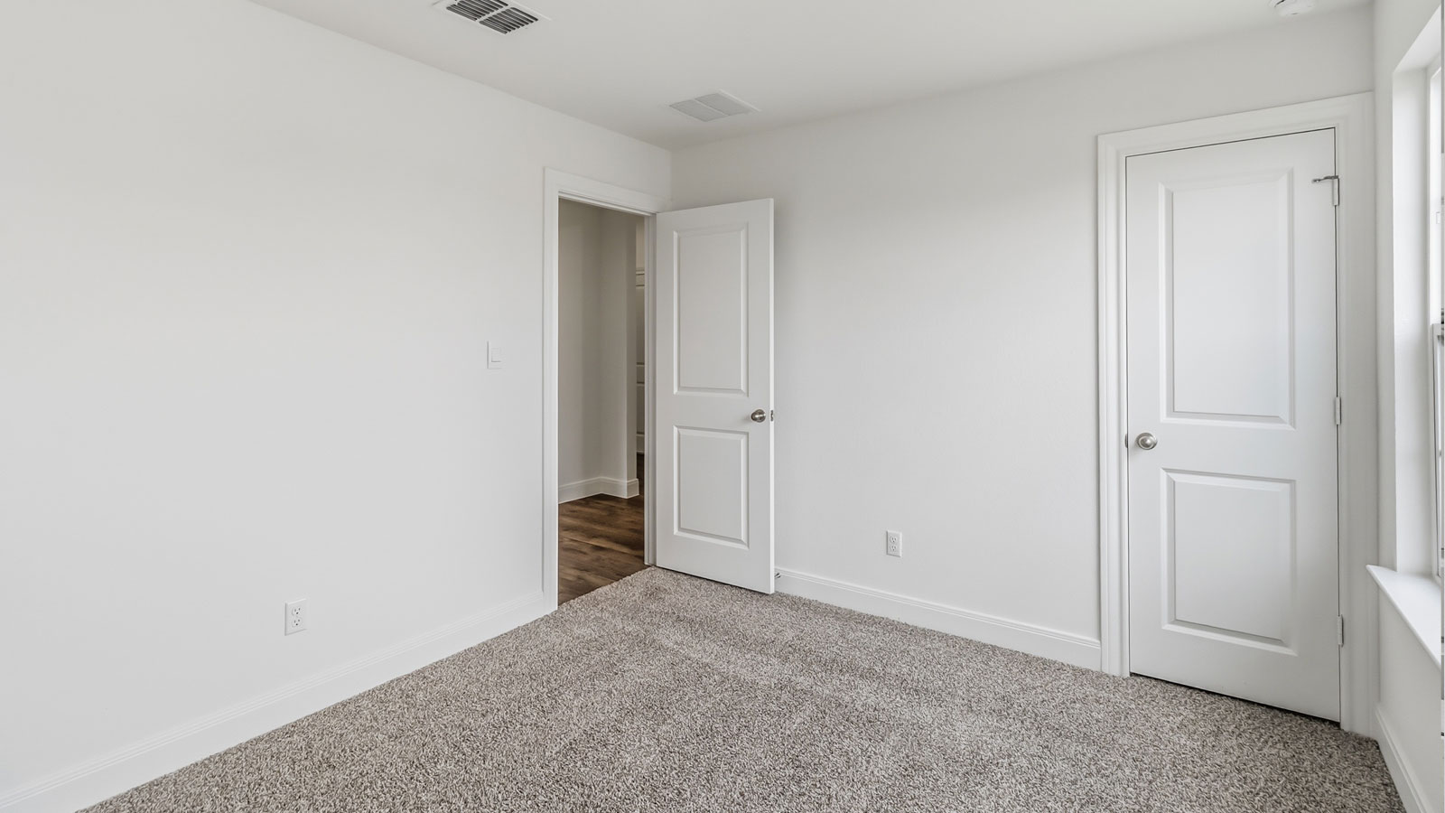Secondary bedroom located at the front of the home.