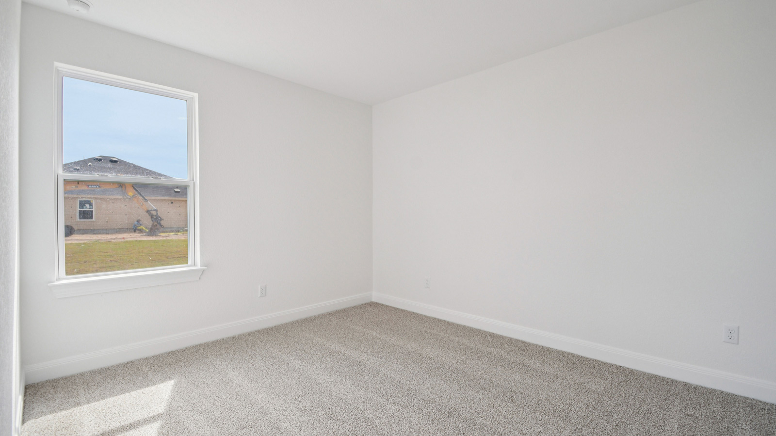 Bedroom 3 with carpeted flooring.