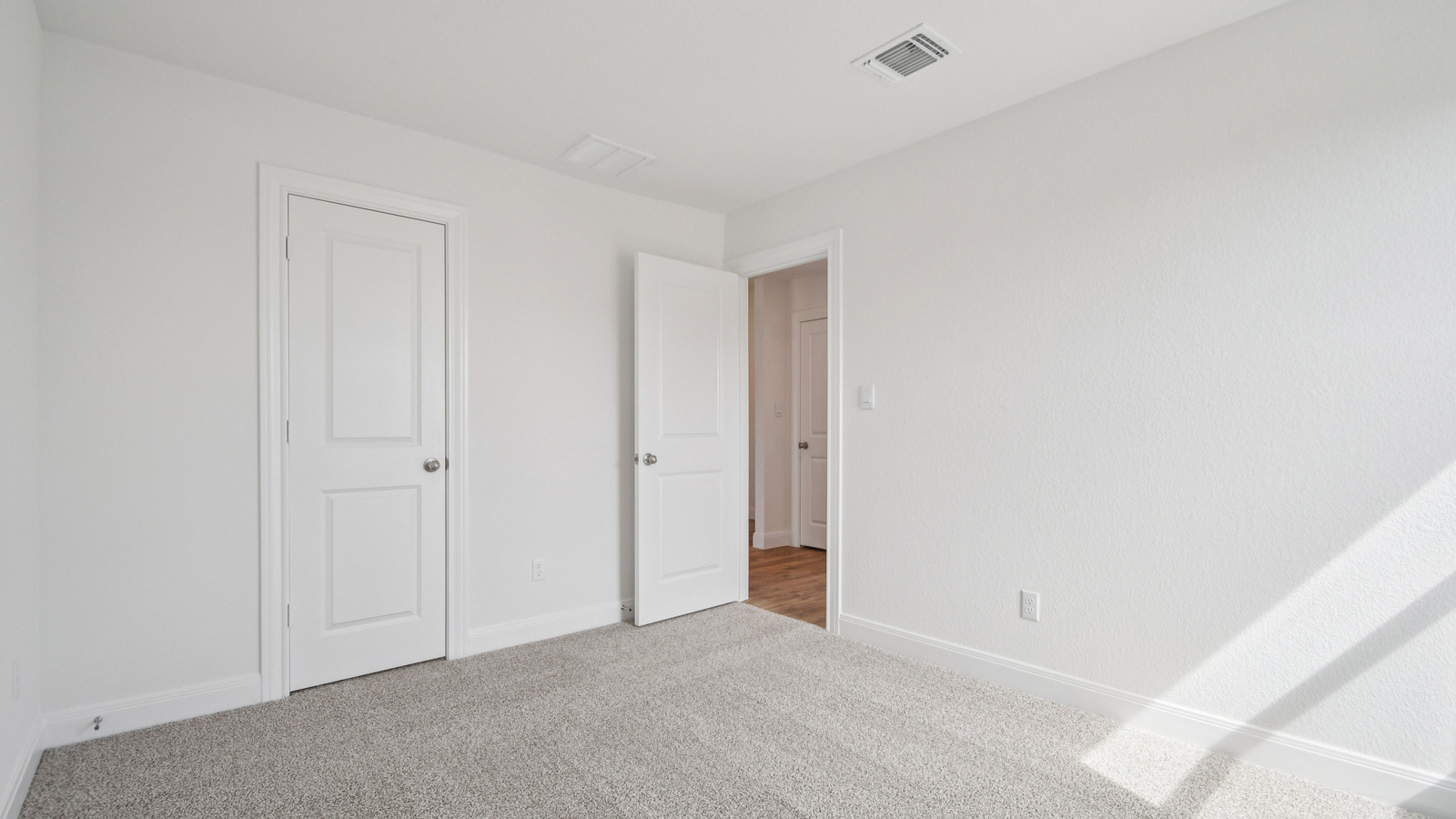 Bedroom 3 with carpeted flooring.