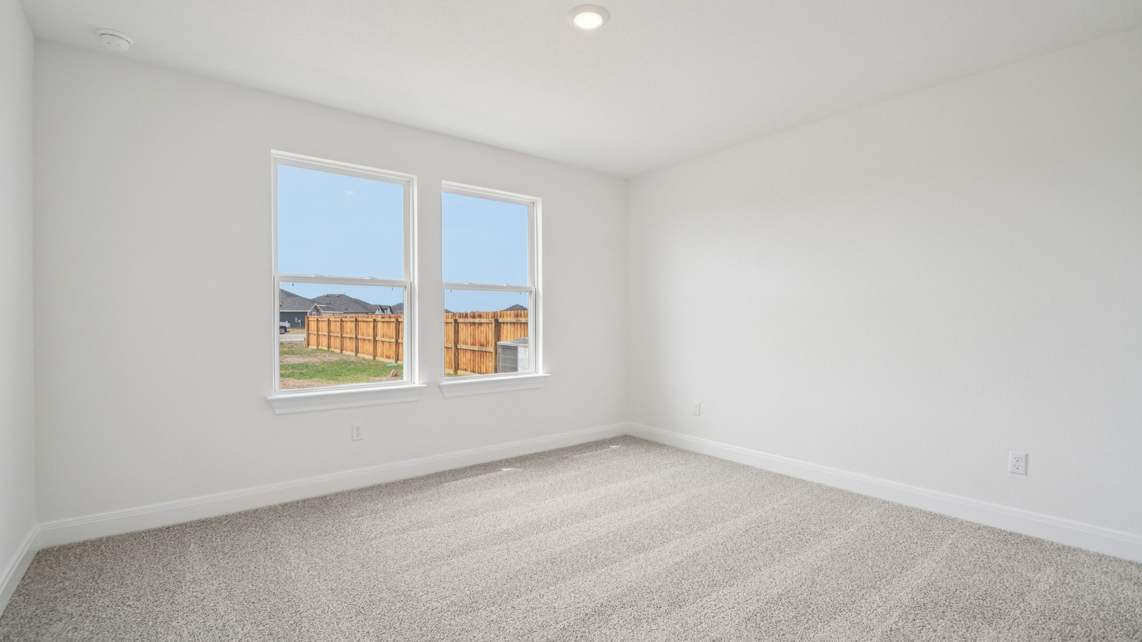 Bedroom 4 with carpeted flooring.