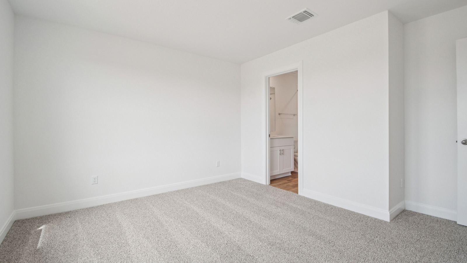 Bedroom 4 with carpeted flooring.