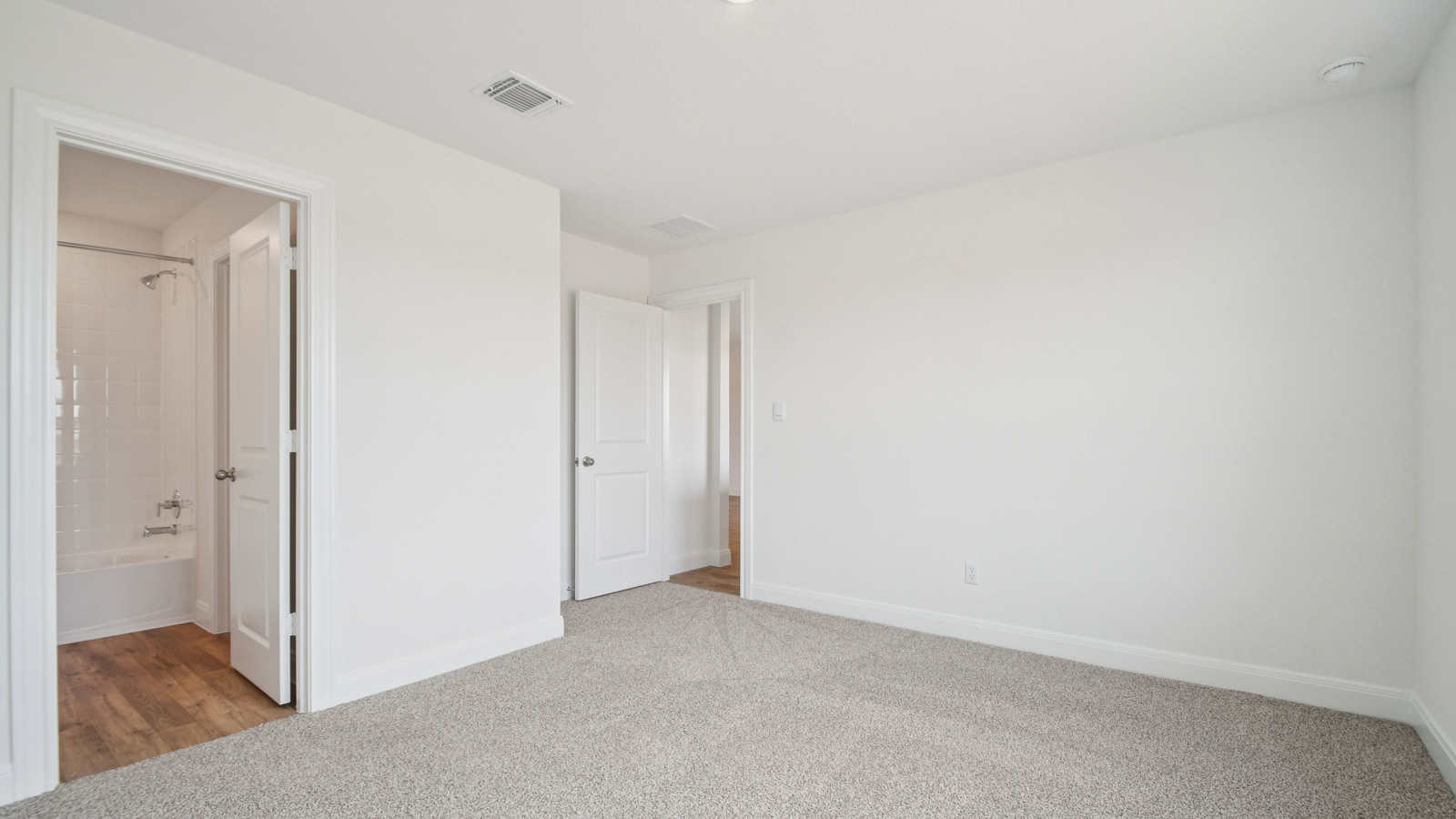 Bedroom 4 with carpeted flooring.