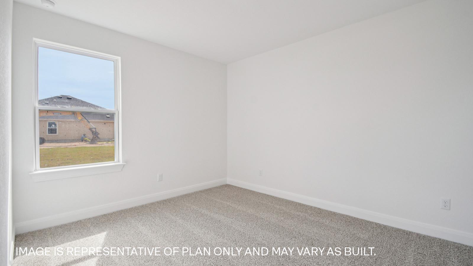 Bedroom 3 with carpeted flooring.
