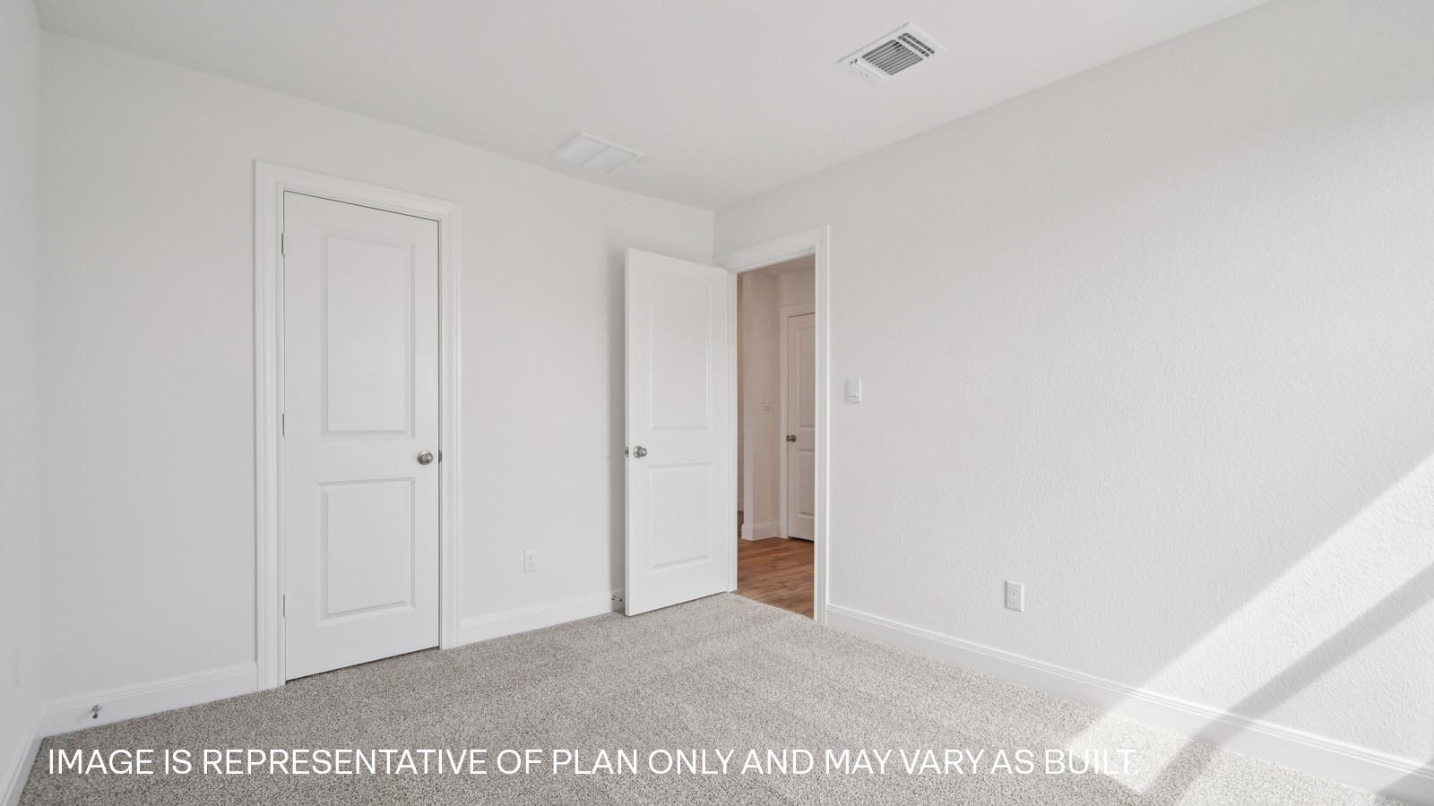 Bedroom 3 with carpeted flooring.