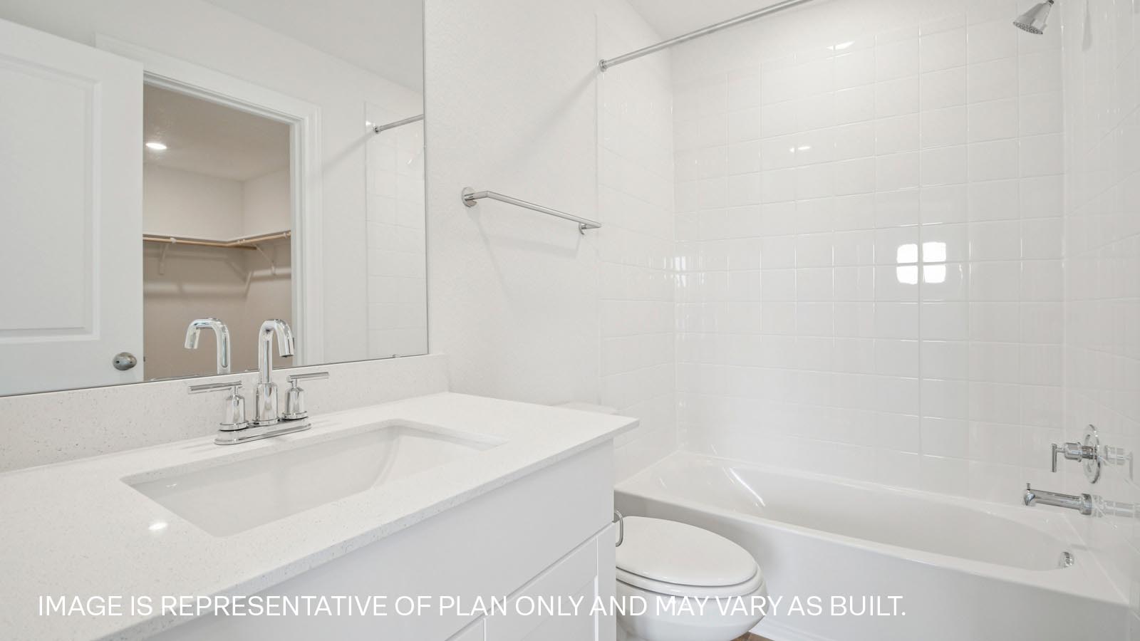 Bathroom in bedroom 4 with shower and bathtub.
