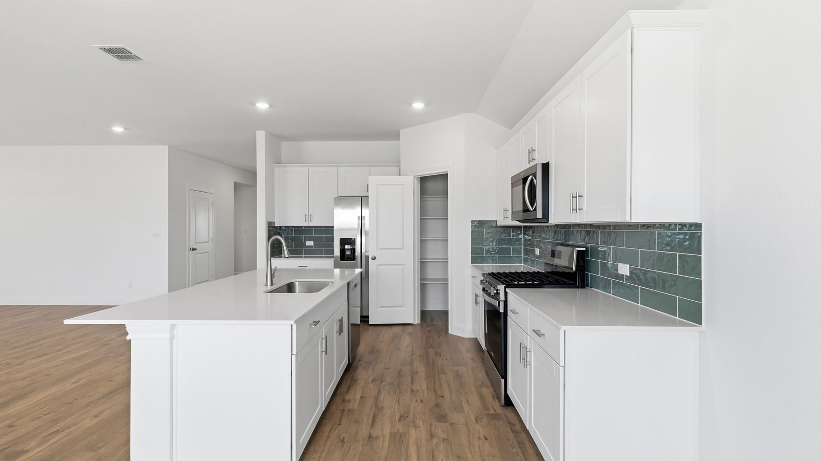 Kitchen with stainless steel appliances.
