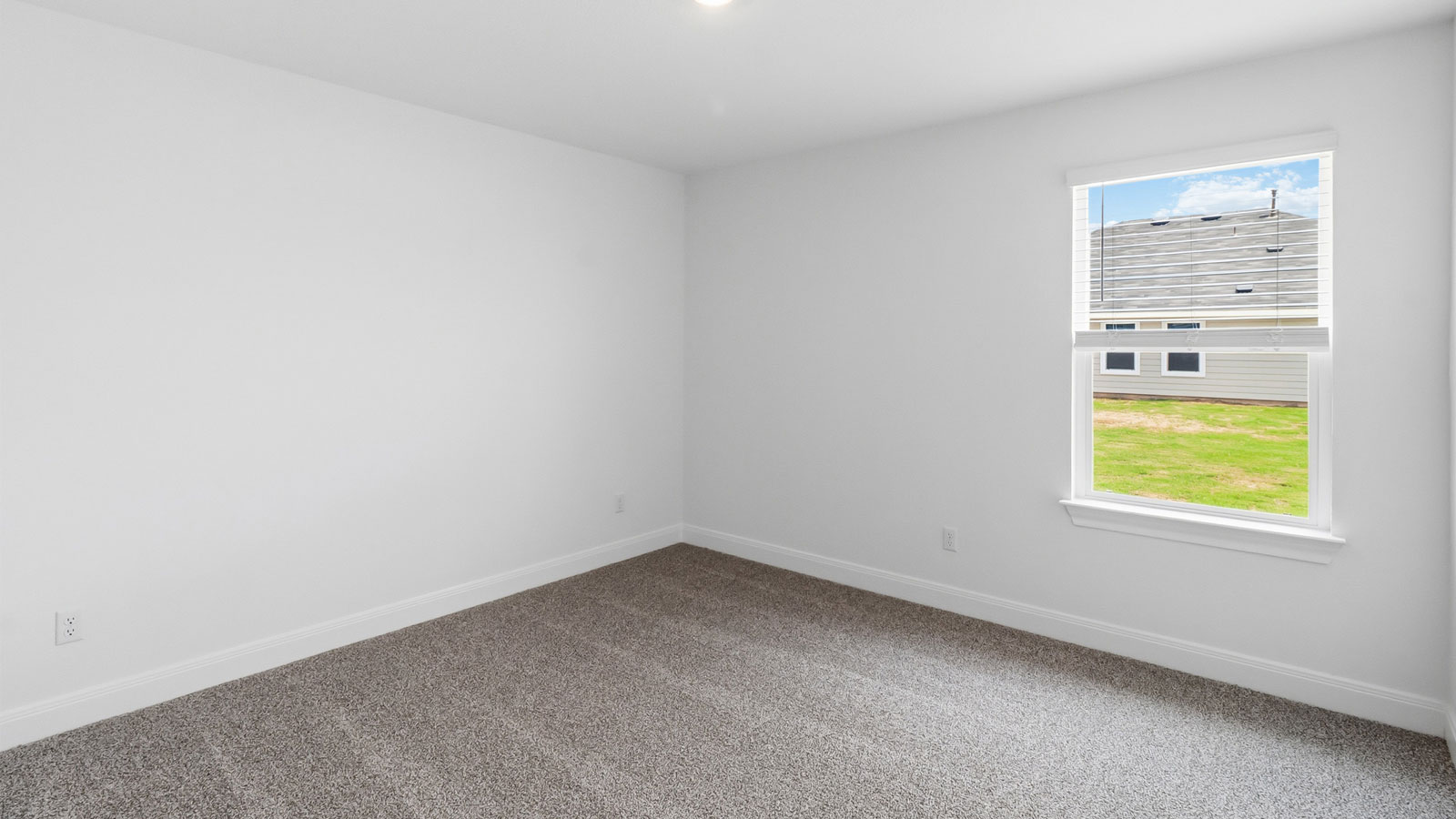 Bedroom 4 with carpeted flooring.
