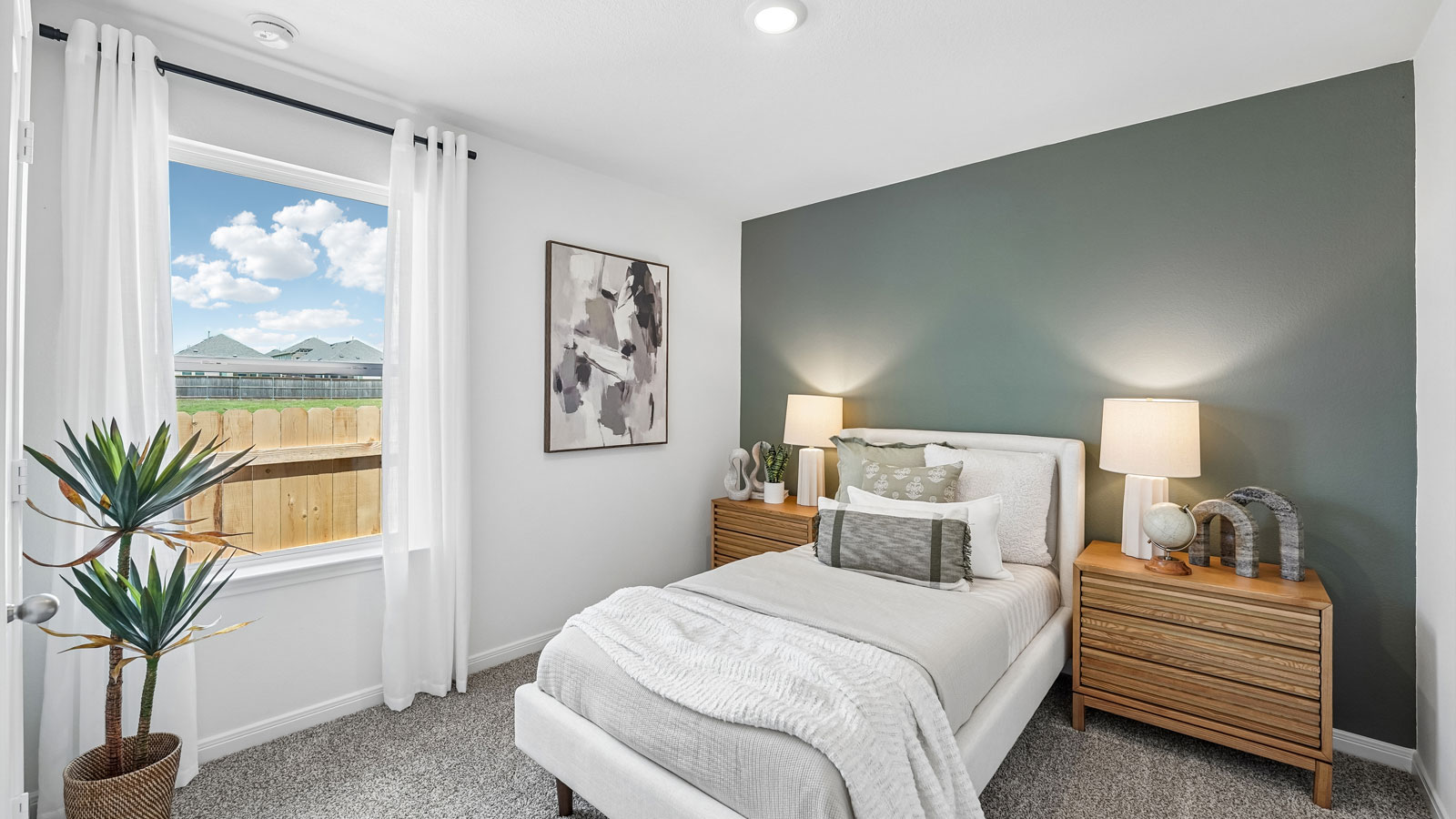 Bedroom 3 with carpeted flooring and window.