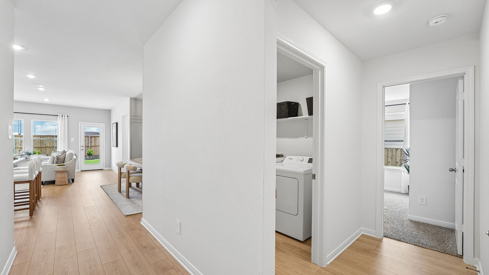 Hallway with premium laminate wood plank flooring.