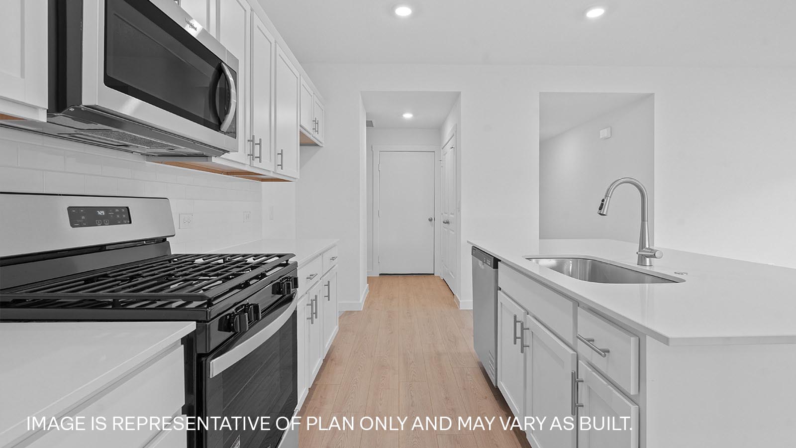 Modern kitchen with white cabinets and a kitchen island