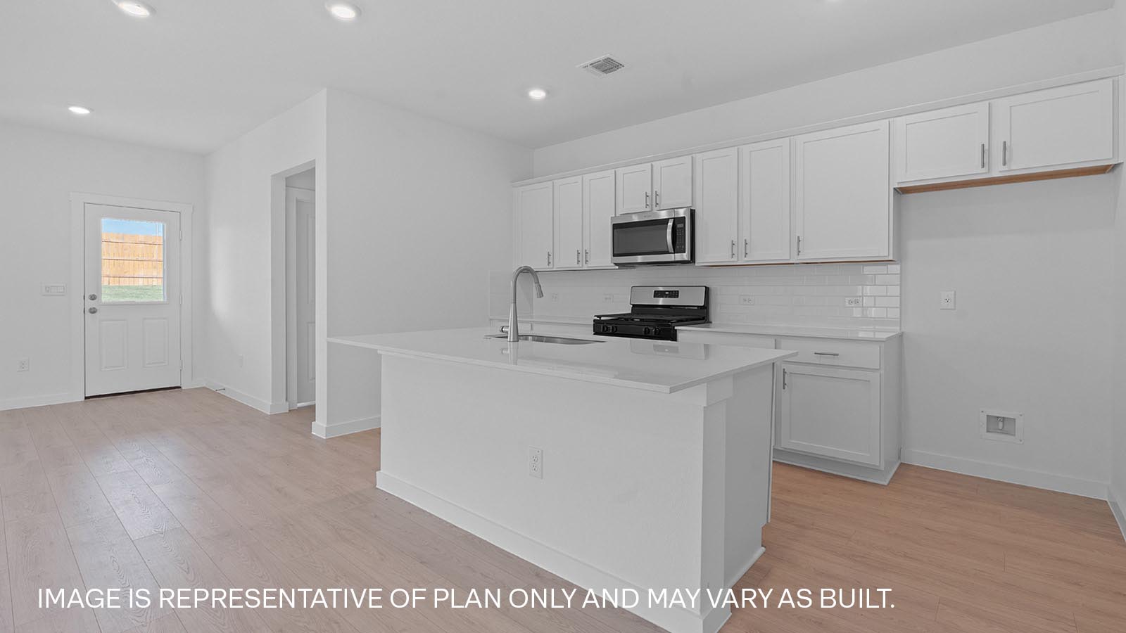 Modern kitchen with white cabinets and a kitchen island
