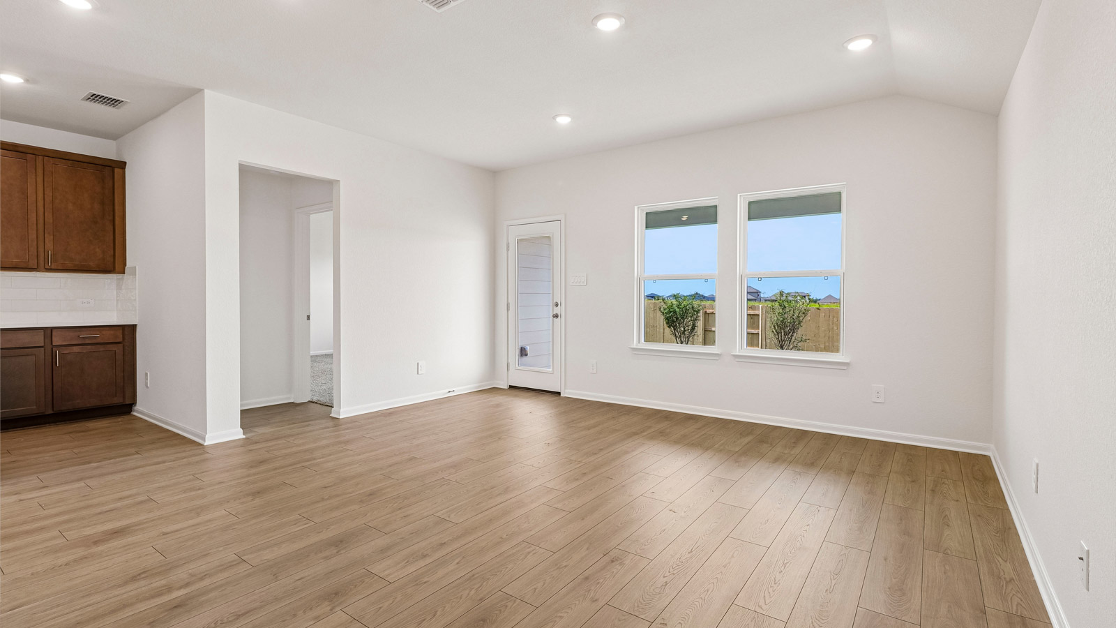 Caden Open Living area with Backyard View