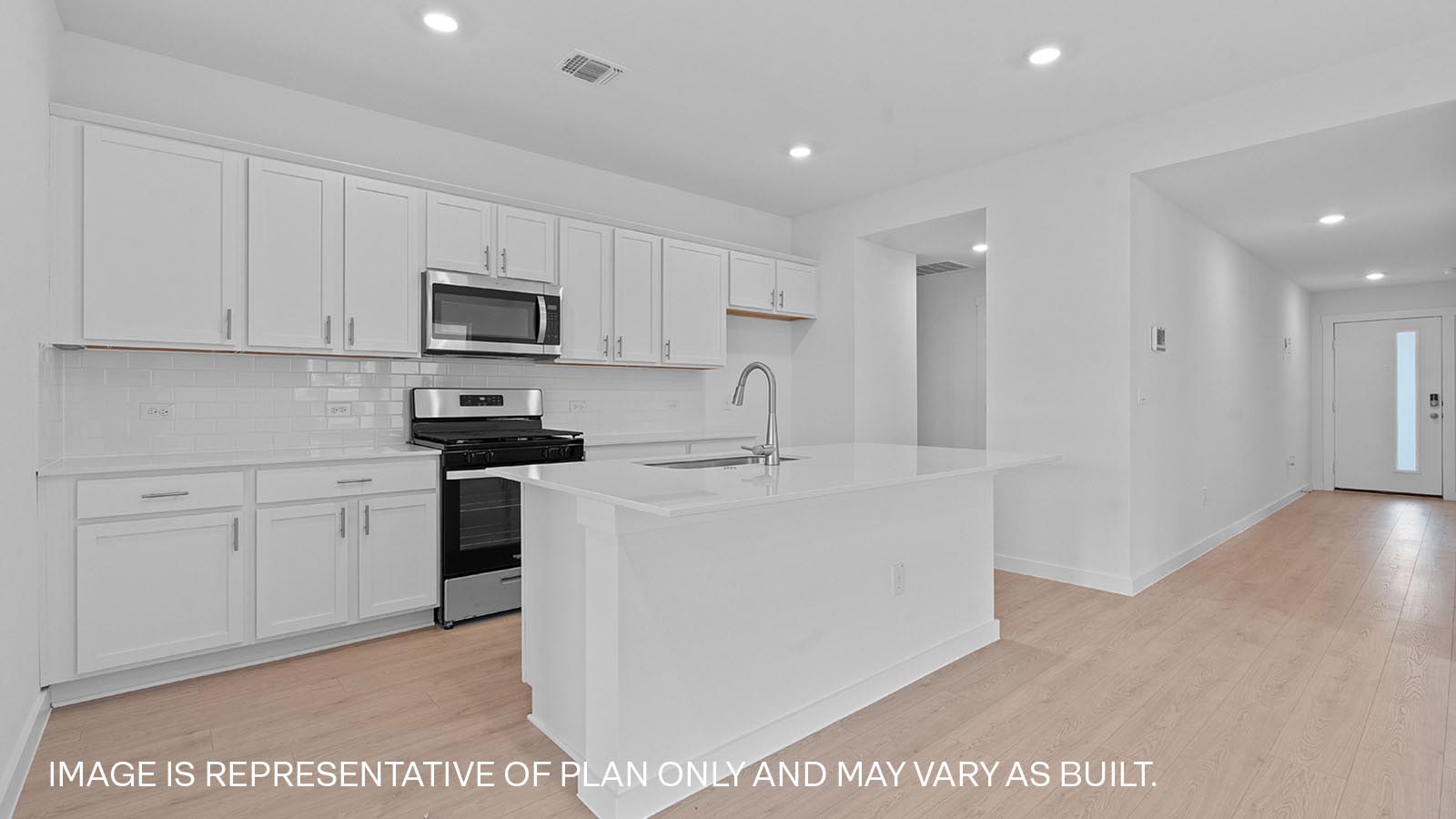 Modern kitchen with white cabinets and a kitchen island