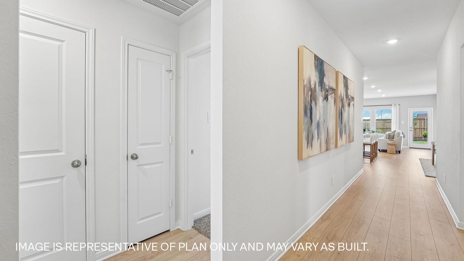 Hallway with premium laminated wood plank flooring.