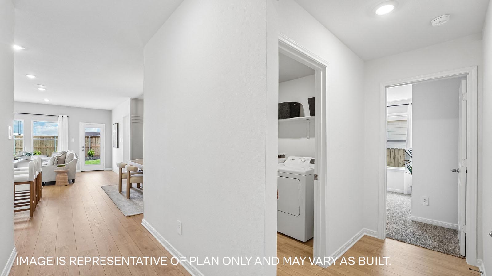 Hallway with premium laminated wood plank flooring.