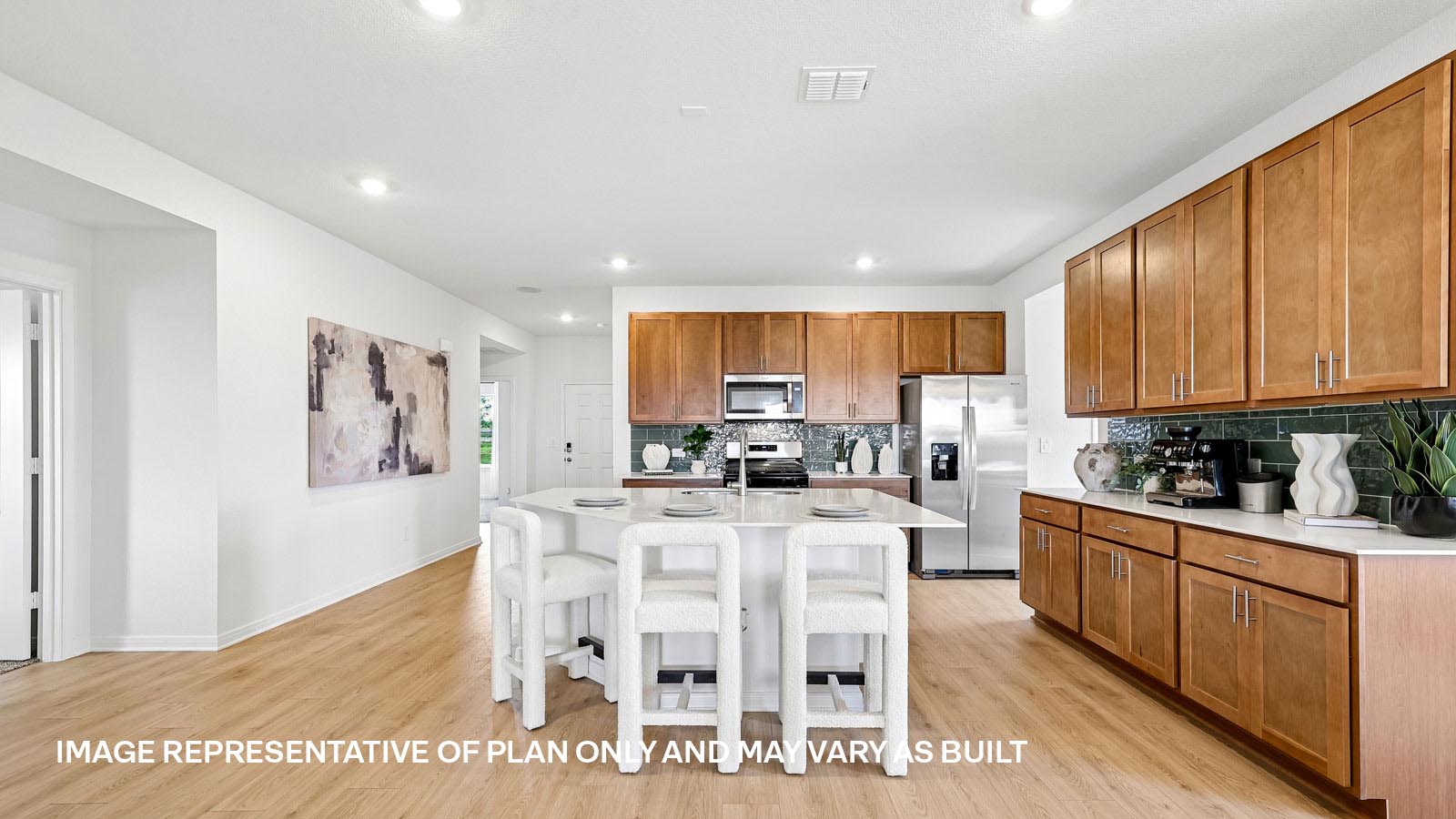 Spacious kitchen with large kitchen island and 42-inch upper kitchen cabinets.