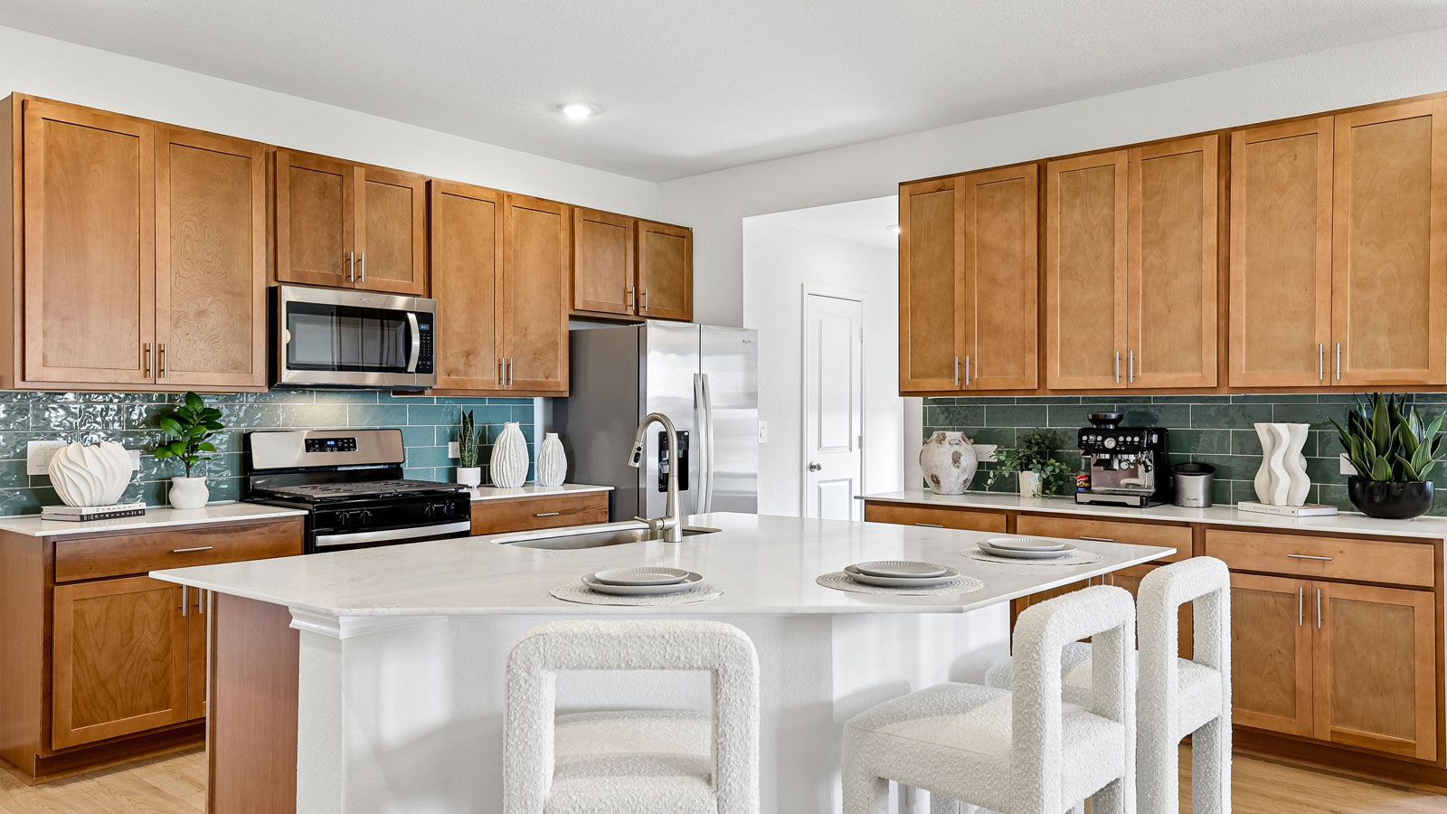 Spacious kitchen with large kitchen island and 42-inch upper kitchen cabinets.