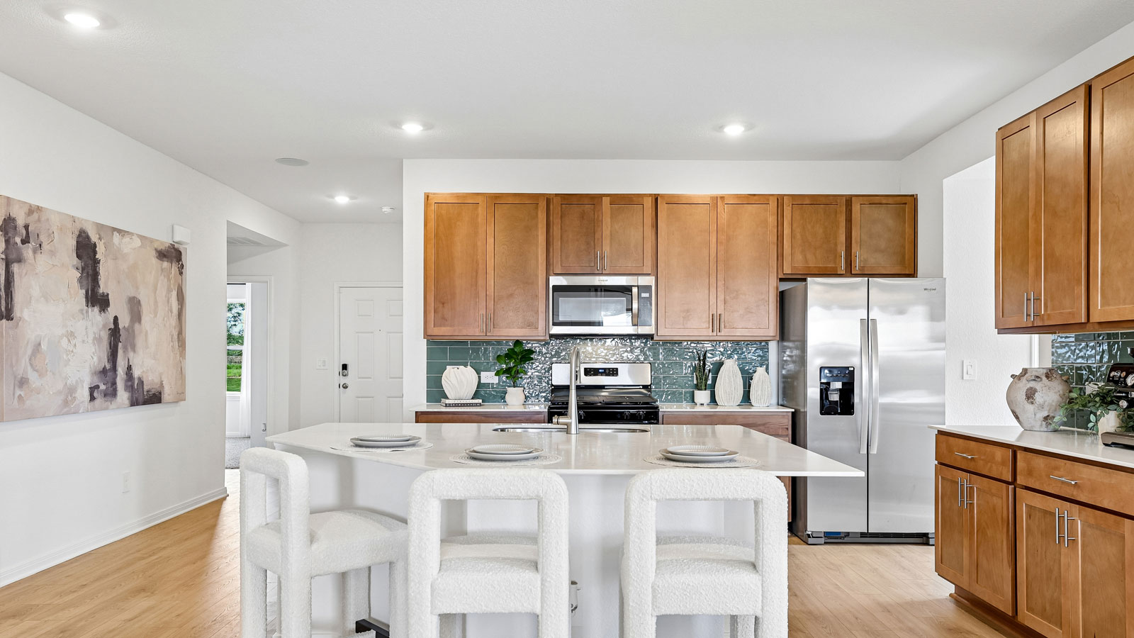 Spacious kitchen with large kitchen island and 42-inch upper kitchen cabinets.