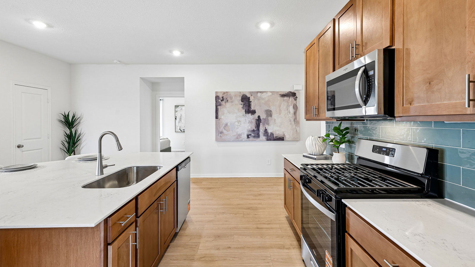Spacious kitchen with large kitchen island and 42-inch upper kitchen cabinets.