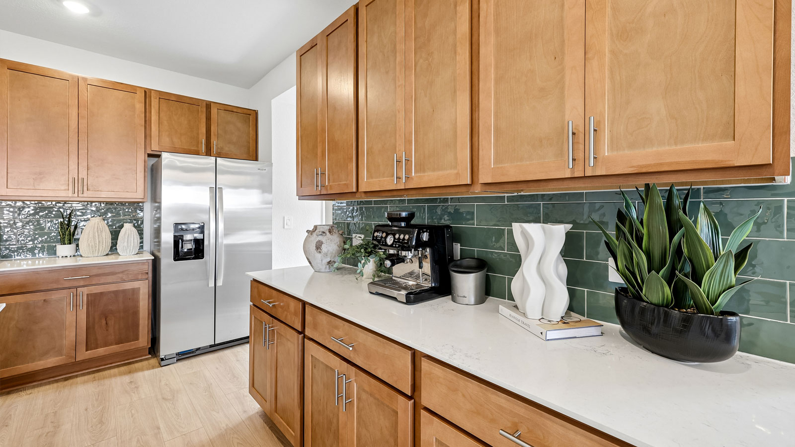 Decorative tile backsplash in kitchen.