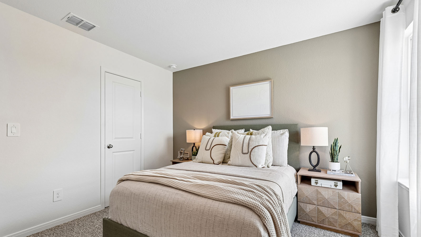 Bedroom 2 with carpeted flooring.