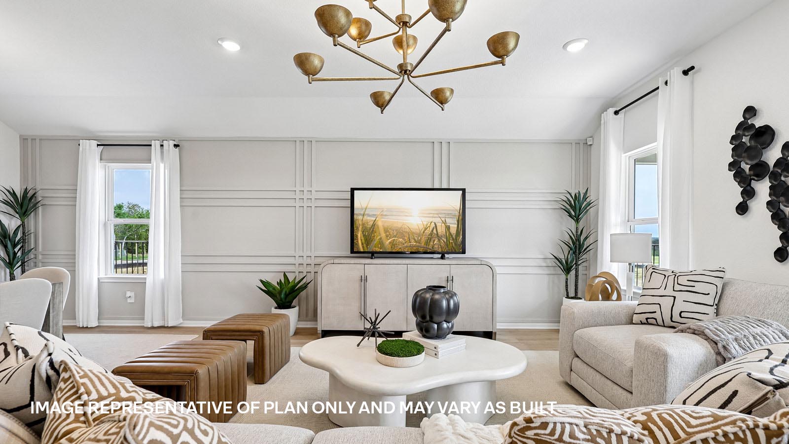 Open living area with premium laminate wood flooring at Kingston model home at Revelry in Del Valle, TX.
