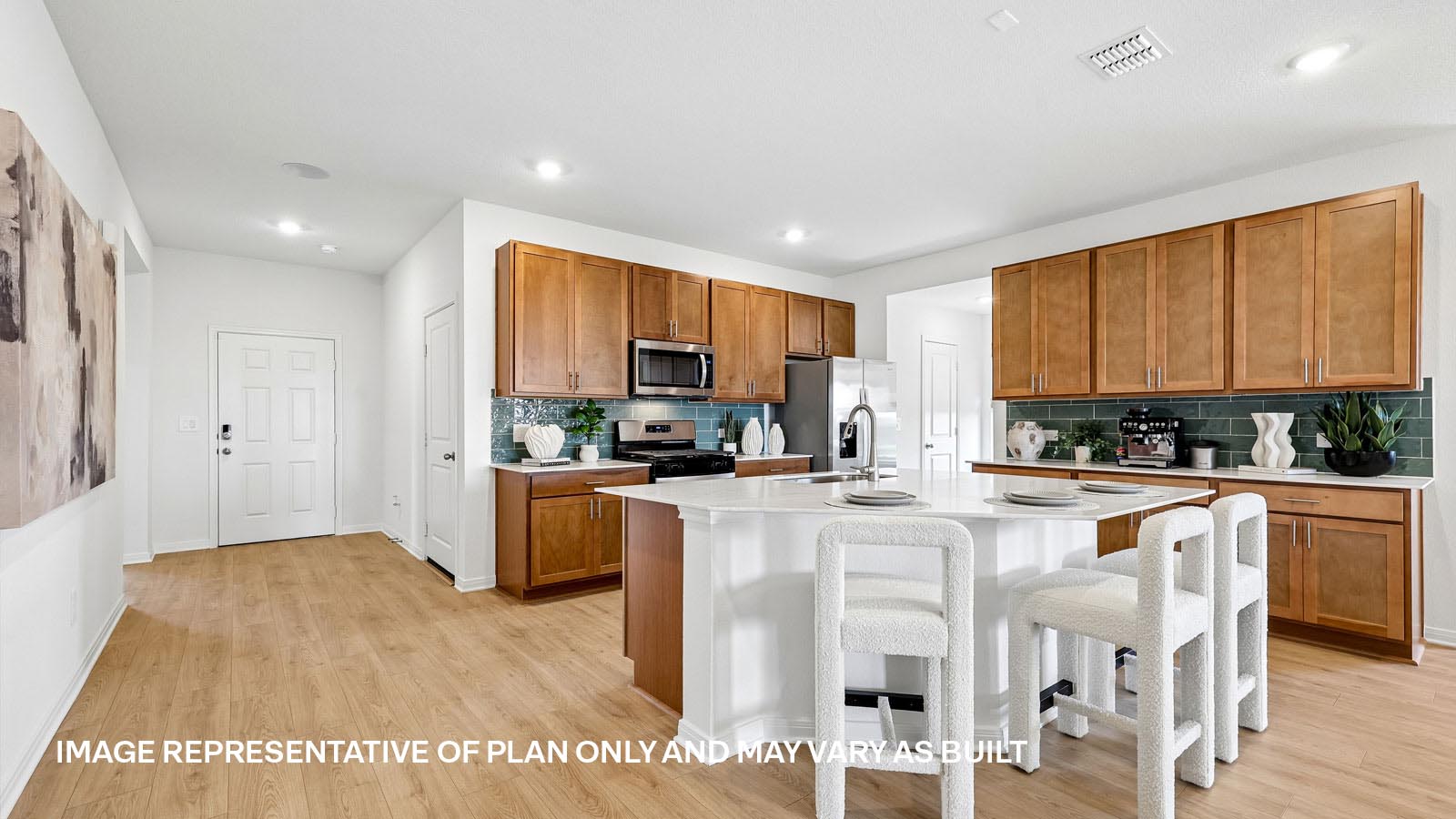 Spacious kitchen with large kitchen island and 42-inch upper kitchen cabinets.