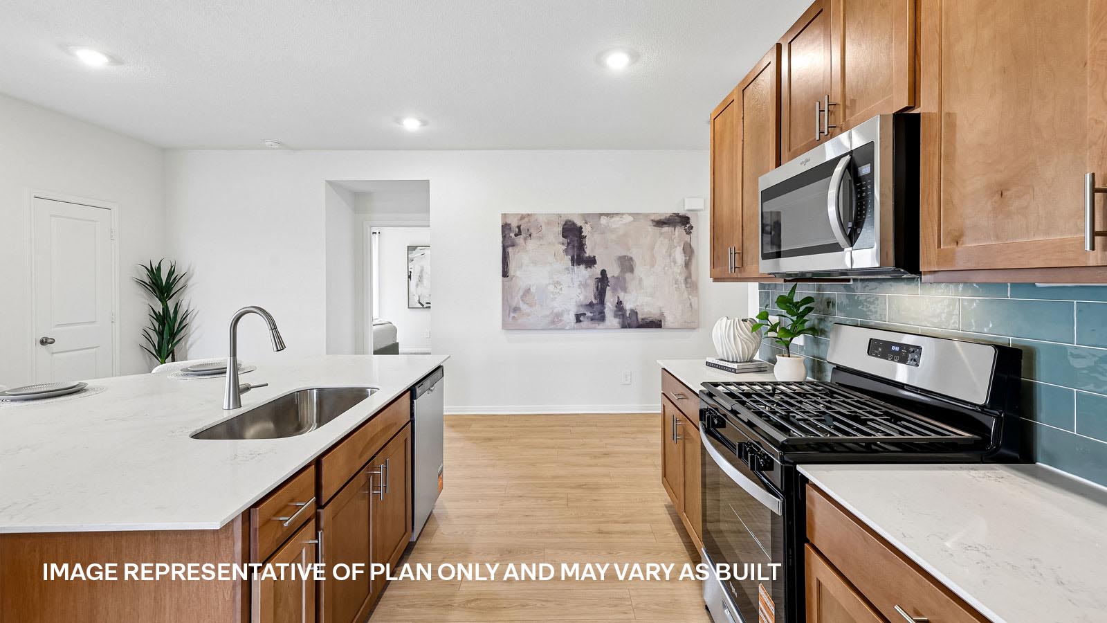 Spacious kitchen with large kitchen island and 42-inch upper kitchen cabinets.