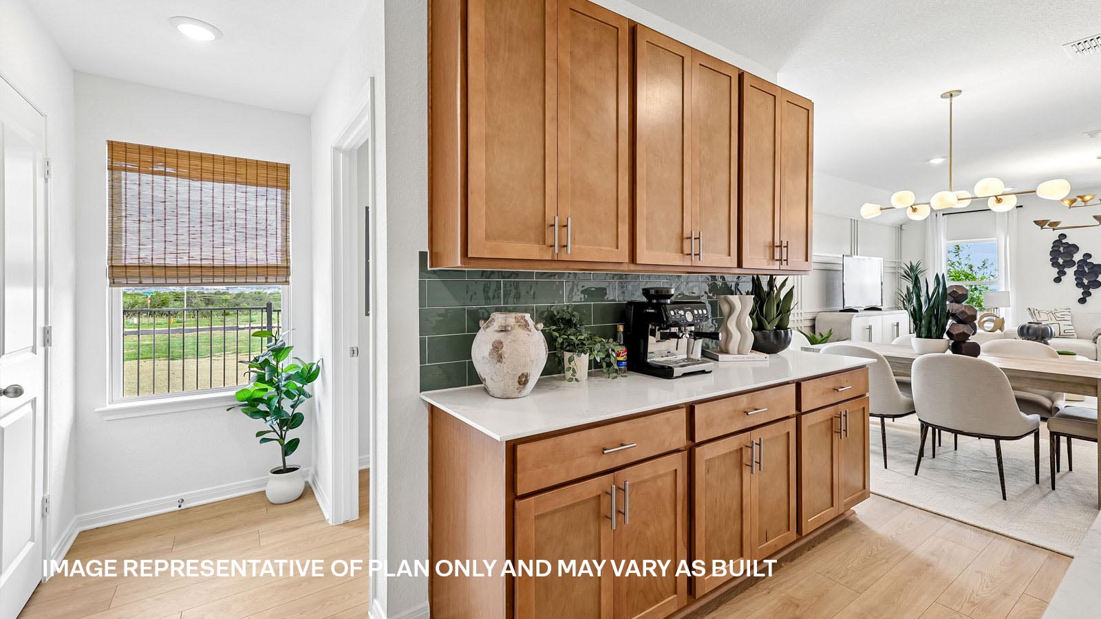 Decorative tile backsplash in kitchen.