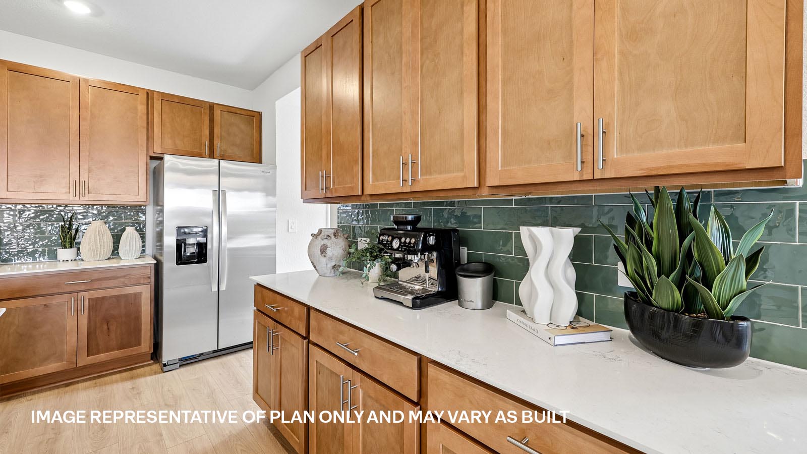 Decorative tile backsplash in kitchen.