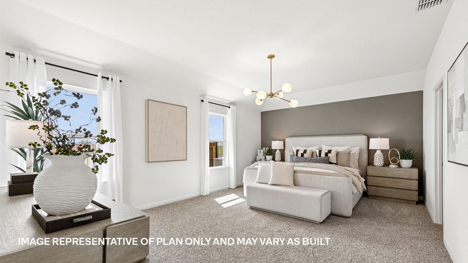 Spacious primary bedroom with carpeted flooring and ensuite bathroom.