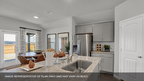 The Irvine kitchen featuring granite countertops, stainless appliances and decorative tile backsplash