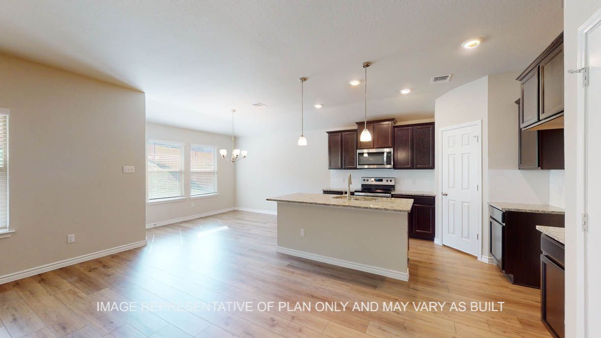 Auburn living room with view into open kitchen.