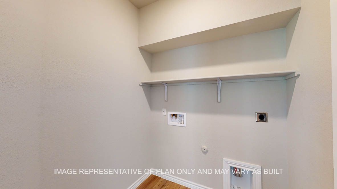 Auburn utility room with storage shelf.