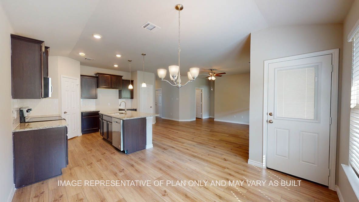 Auburn dining room with view into open concept kitchen.
