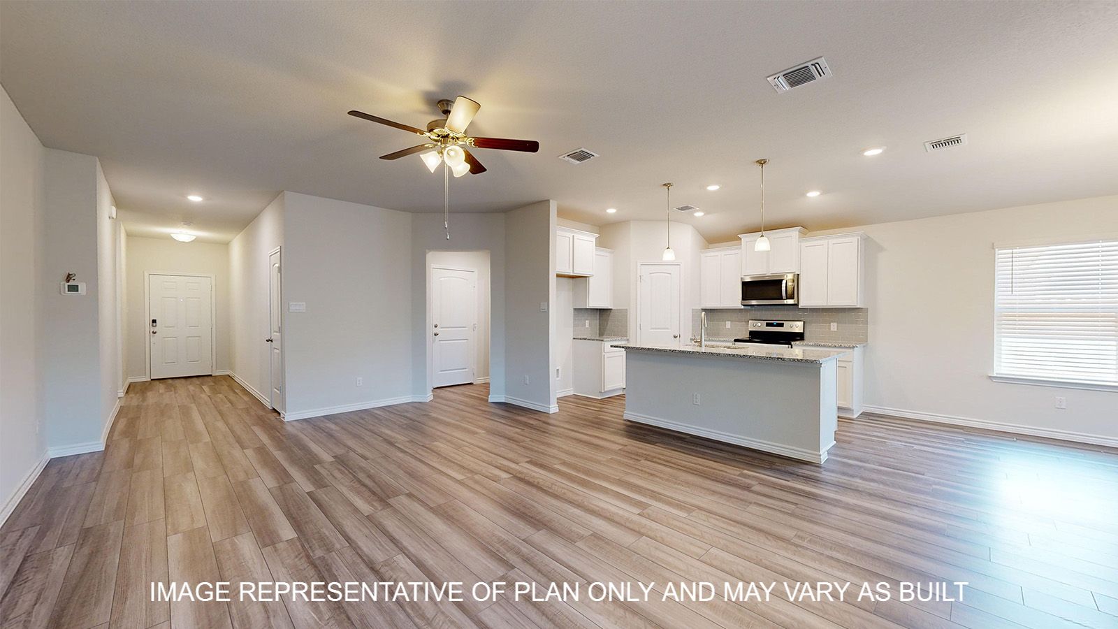 Alpine living room with view into kitchen and dining room.