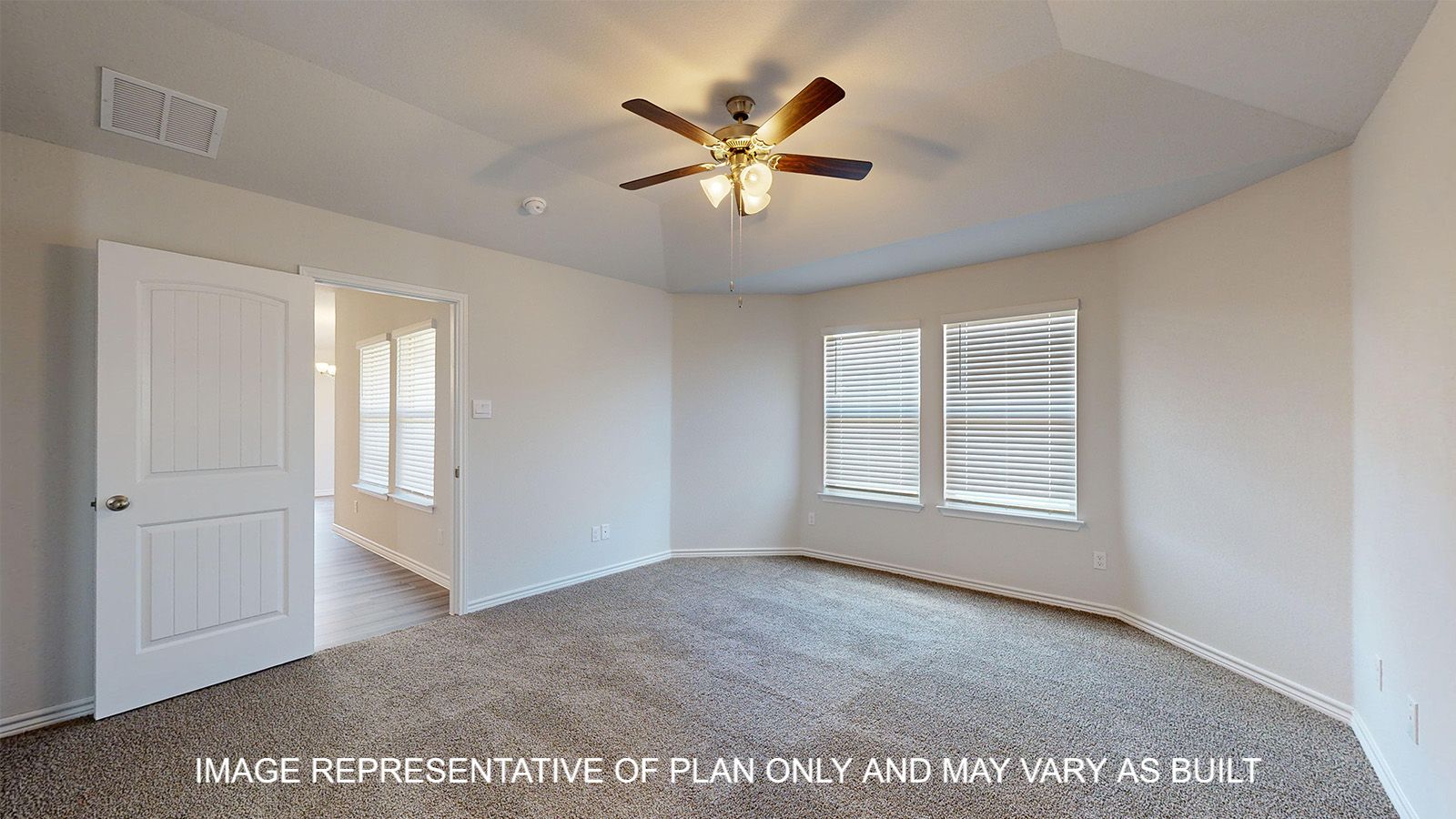 Alpine primary bedroom with carpet flooring and bay windows.