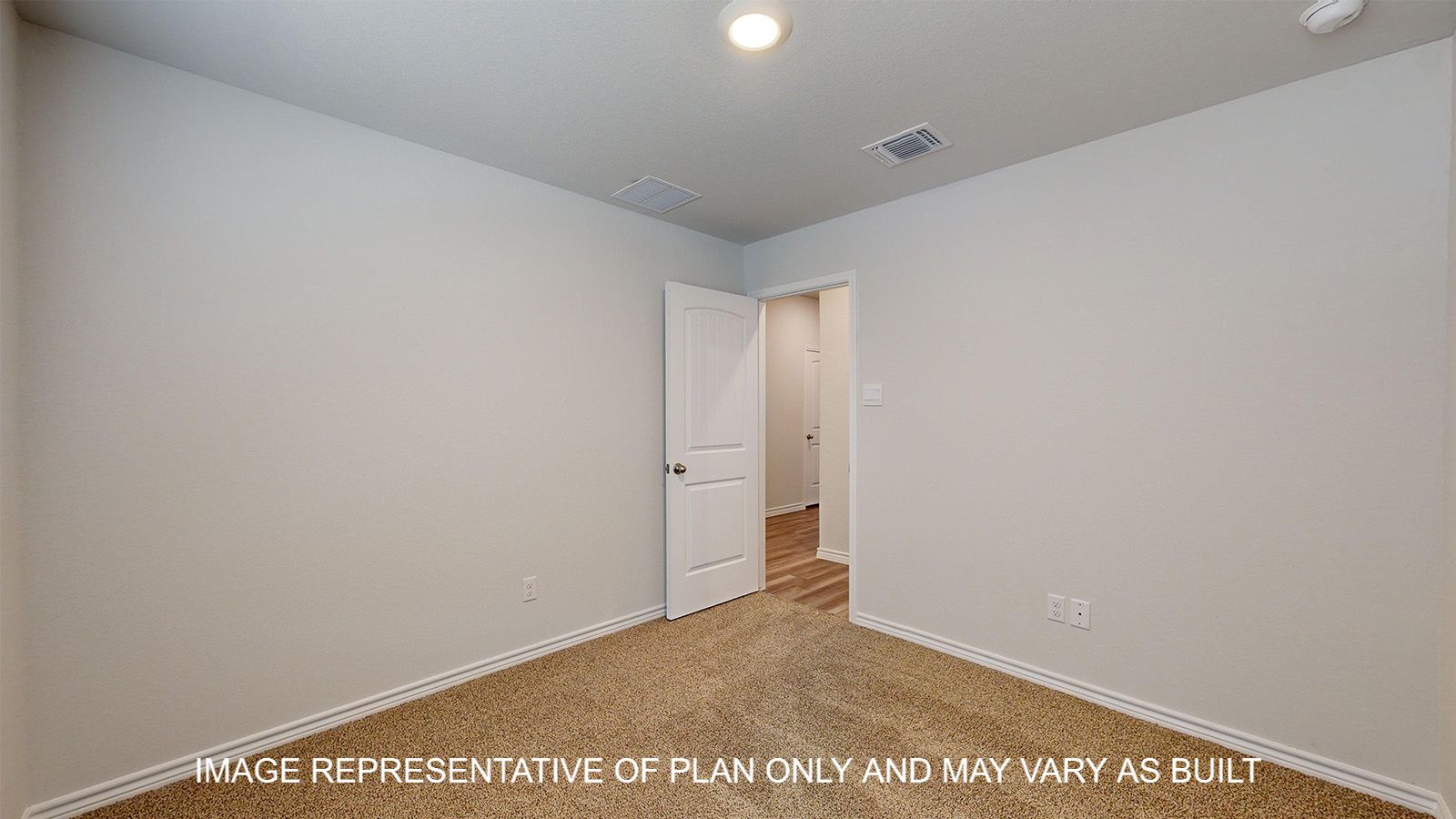 Alpine secondary bedroom with carpet flooring and view into hallway.