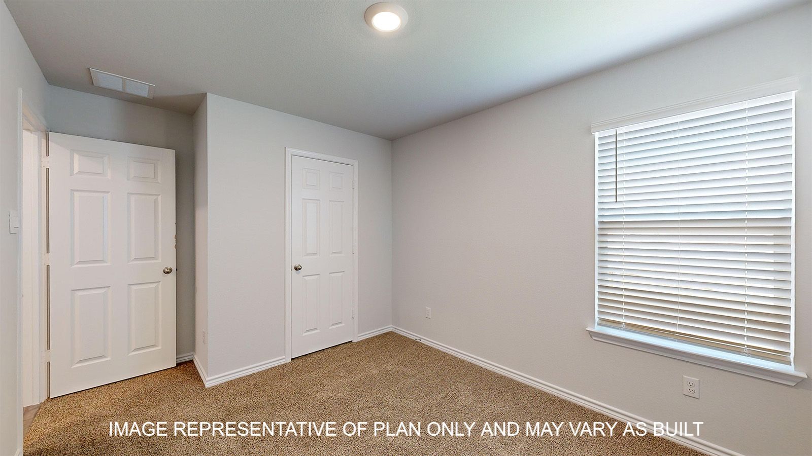 Dakota secondary bedroom with carpet flooring.